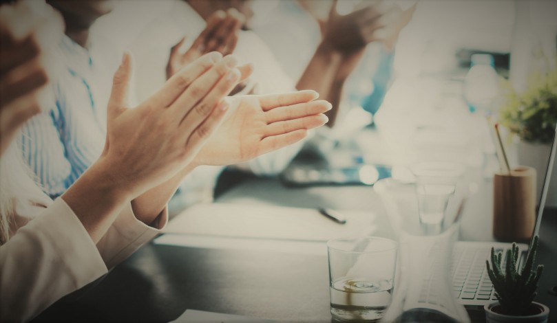 Closeup photo of partners clapping hands after business seminar. Professional